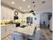 Modern kitchen with white cabinets, a breakfast bar, and stainless steel appliances at 308 Rustic Loop, Sanford, FL 32771