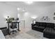 Loft area with a large sofa, desk, and natural light at 308 Rustic Loop, Sanford, FL 32771