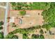 Overhead view of the expansive property with pool, house, and land outlined in red at 32510 Wolf Branch Ln, Sorrento, FL 32776