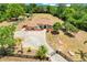 Aerial view of a house showcasing a sprawling estate with lush landscaping and a long driveway at 32510 Wolf Branch Ln, Sorrento, FL 32776