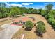 Aerial shot of property with circular driveway and a large manicured lawn at 32510 Wolf Branch Ln, Sorrento, FL 32776
