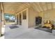 Covered portion of barn with stalls, mower, and secure entrances at 32510 Wolf Branch Ln, Sorrento, FL 32776