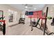 Well-lit exercise room with a ceiling fan and an array of equipment for a complete workout at 32510 Wolf Branch Ln, Sorrento, FL 32776