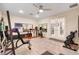 A home exercise room featuring workout machines, weights, mirrors, and plenty of space to stay fit at 32510 Wolf Branch Ln, Sorrento, FL 32776