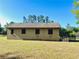 Exterior view of a horse barn on a well manicured lot at 32510 Wolf Branch Ln, Sorrento, FL 32776