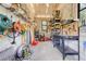 Spacious garage with shelving, workbench, and tool storage at 32510 Wolf Branch Ln, Sorrento, FL 32776