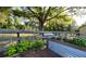 Lush garden beds with a wooden fence surround providing a peaceful oasis for growing herbs and vegetables at 32510 Wolf Branch Ln, Sorrento, FL 32776