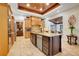 Spacious kitchen with center island, stainless steel appliances and custom cabinets at 32510 Wolf Branch Ln, Sorrento, FL 32776