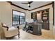 Inviting office with a custom built-in desk, shelving, and a large window for natural light at 32510 Wolf Branch Ln, Sorrento, FL 32776
