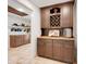 Spacious pantry featuring custom wood cabinets, wine rack and storage for all your essentials at 32510 Wolf Branch Ln, Sorrento, FL 32776