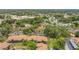 Wide aerial shot capturing the property within a lush, tree-filled community at 516 Bahia Cir # B, Ocala, FL 34472