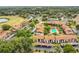 Aerial view highlighting the property within a community featuring a pool and manicured landscaping at 516 Bahia Cir # B, Ocala, FL 34472