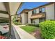 A well-maintained two-story apartment building with beautiful landscaping and covered parking at 516 Bahia Cir # B, Ocala, FL 34472