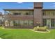 Building's exterior view with a well-manicured lawn and screened-in lanais, offering comfort and privacy at 516 Bahia Cir # B, Ocala, FL 34472