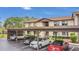 Two-story apartment building featuring covered parking for multiple vehicles at 516 Bahia Cir # B, Ocala, FL 34472