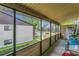 Enjoy the view from your enclosed lanai. The pool is just steps away! at 516 Bahia Cir # B, Ocala, FL 34472