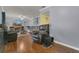 Spacious living room features hardwood floors, a fireplace, and comfortable seating at 516 Bahia Cir # B, Ocala, FL 34472