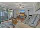 Inviting living room with fireplace, sliding doors to the lanai and wood floors at 516 Bahia Cir # B, Ocala, FL 34472