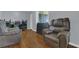 A living room with hardwood floors and two leather reclining chairs at 516 Bahia Cir # B, Ocala, FL 34472