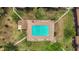 An aerial shot of the community pool, surrounded by lounge chairs and lush landscaping at 516 Bahia Cir # B, Ocala, FL 34472