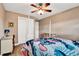Bedroom featuring wood-look floors, neutral paint, a ceiling fan, and large closet at 516 Polaris Loop # 110, Casselberry, FL 32707