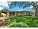 Tan-colored home with a well-maintained lawn and mature landscaping in a desirable neighborhood at 516 Polaris Loop # 110, Casselberry, FL 32707