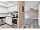 Kitchen with new cabinets, granite counters, stainless appliances and a view of the dining area at 516 Polaris Loop # 110, Casselberry, FL 32707