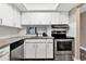 Bright kitchen with granite counters, stainless steel appliances and white subway tile backsplash at 516 Polaris Loop # 110, Casselberry, FL 32707