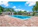 Community pool featuring plenty of lounge seating and landscaping in a beautiful shared space at 516 Polaris Loop # 110, Casselberry, FL 32707