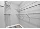 Walk-in closet featuring wire shelving and modern gray wood-look floors at 516 Polaris Loop # 110, Casselberry, FL 32707