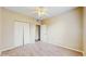 Bedroom showcasing a ceiling fan, carpet and a closet at 5512 Metrowest Blvd # 203, Orlando, FL 32811