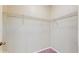 Walk-in closet with wire shelving and carpet at 5512 Metrowest Blvd # 203, Orlando, FL 32811