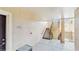 Condominium complex hallway with stairs leading to upper floors and unit 203 at 5512 Metrowest Blvd # 203, Orlando, FL 32811