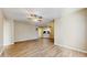 Open-concept living space with modern flooring, seamlessly connecting to the kitchen area at 5512 Metrowest Blvd # 203, Orlando, FL 32811