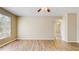 Inviting living space features stylish flooring and a large window, creating a warm ambiance at 5512 Metrowest Blvd # 203, Orlando, FL 32811