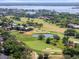 Wonderful aerial view of the golf course with pond and surrounding lush trees, homes, and landscaping at 6054 Tarawood Dr, Orlando, FL 32819