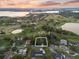 Desirable property with an aerial view, near a golf course, trees, lake, and other houses nearby at 6054 Tarawood Dr, Orlando, FL 32819
