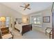 Comfortable bedroom with neutral walls, ceiling fan and window bench at 6054 Tarawood Dr, Orlando, FL 32819