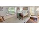 Bedroom with large window, desk, rocking chair and carpet at 6054 Tarawood Dr, Orlando, FL 32819
