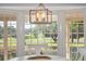Charming breakfast nook with bay window offers serene golf course views and natural light at 6054 Tarawood Dr, Orlando, FL 32819