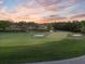 Scenic view of a meticulously maintained golf course with lush green fairways and mature trees at 6054 Tarawood Dr, Orlando, FL 32819