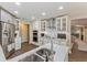 Modern kitchen featuring stainless appliances, white cabinets, and an open design for entertaining at 6054 Tarawood Dr, Orlando, FL 32819