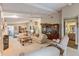 Spacious living room with ceiling beams, neutral colors, fireplace, and comfortable seating at 6054 Tarawood Dr, Orlando, FL 32819