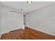 Comfortable bedroom featuring hardwood floors and a built-in closet at 66 Silver Falls Cir, Kissimmee, FL 34743
