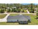 New modern farmhouse-style home on a spacious lot surrounded by lush greenery and mature trees at 6725 Sw 131St Cir, Ocala, FL 34481
