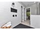 Walk-in shower with white subway tile and matte black hardware in a modern bathroom at 6725 Sw 131St Cir, Ocala, FL 34481