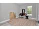Bright bedroom with a large rug and a desk by the window at 6725 Sw 131St Cir, Ocala, FL 34481
