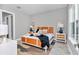 A comfortable bedroom featuring stylish decor and a neutral color palette at 6725 Sw 131St Cir, Ocala, FL 34481