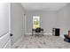Bedroom with a sleek desk setup and wood-look flooring at 6725 Sw 131St Cir, Ocala, FL 34481