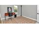 Bedroom with a patterned rug, desk, and window view at 6725 Sw 131St Cir, Ocala, FL 34481